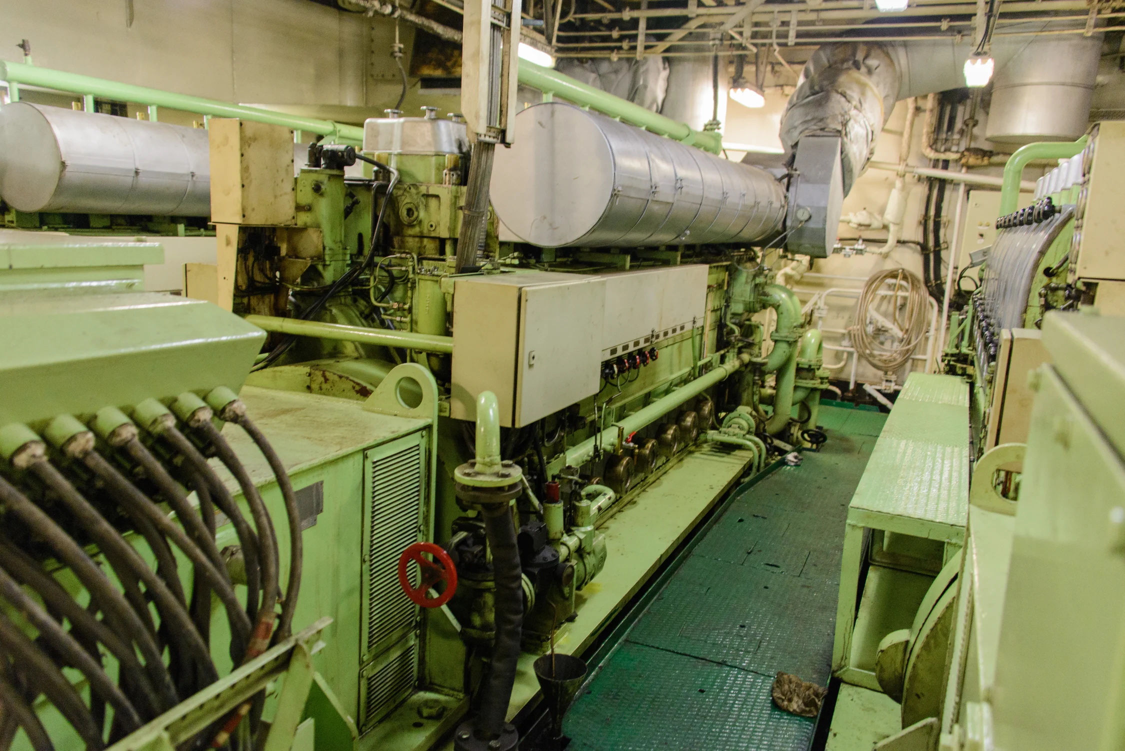 Engine room of a large ship showing installed marine propulsion machinery