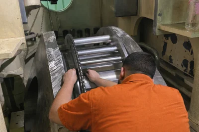 Engineer working on large crankpin during in-situ crankpin machining repair